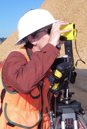 Jason Martin measuring a chip pile